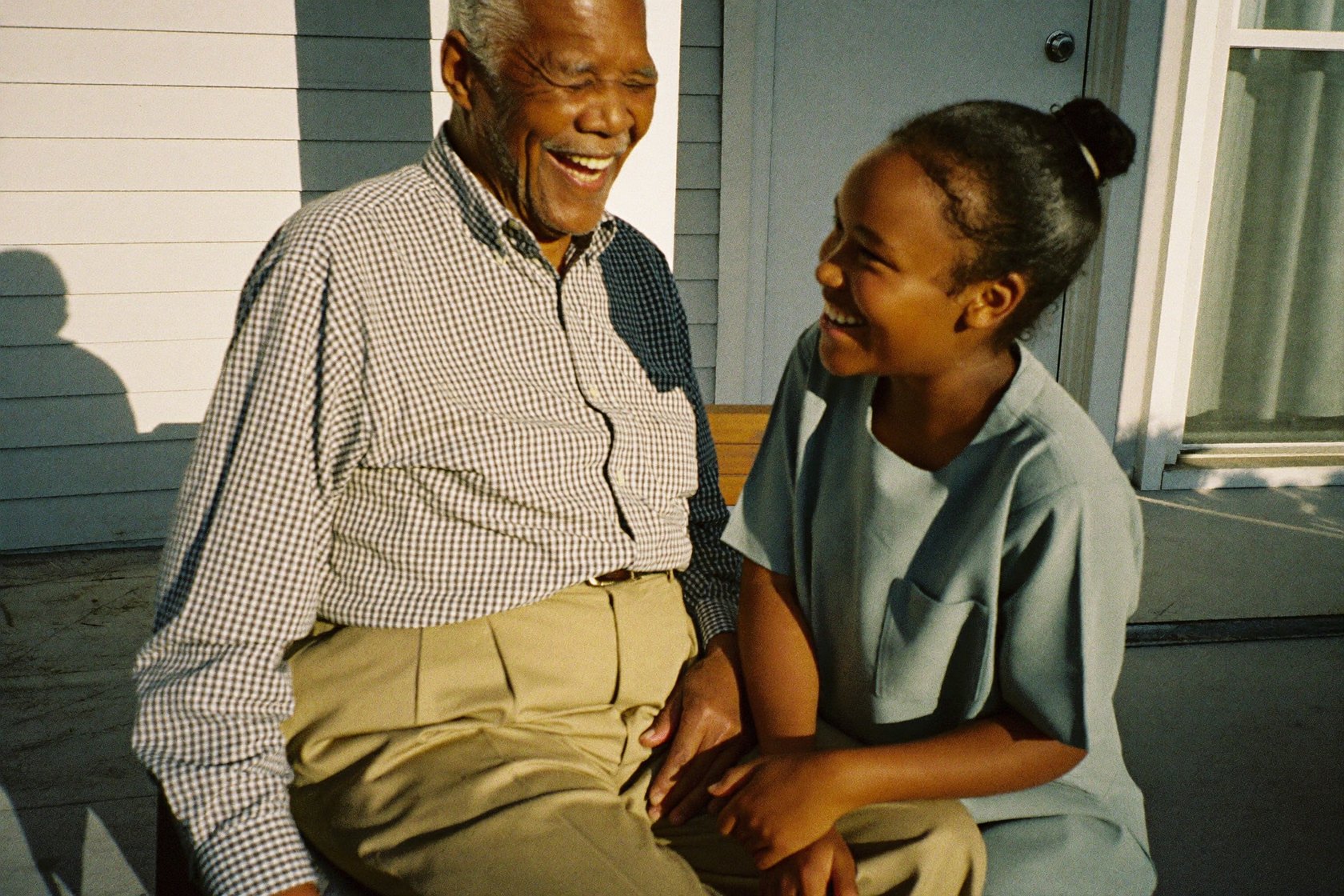 A senior man enjoying the outdoors with his caregiver